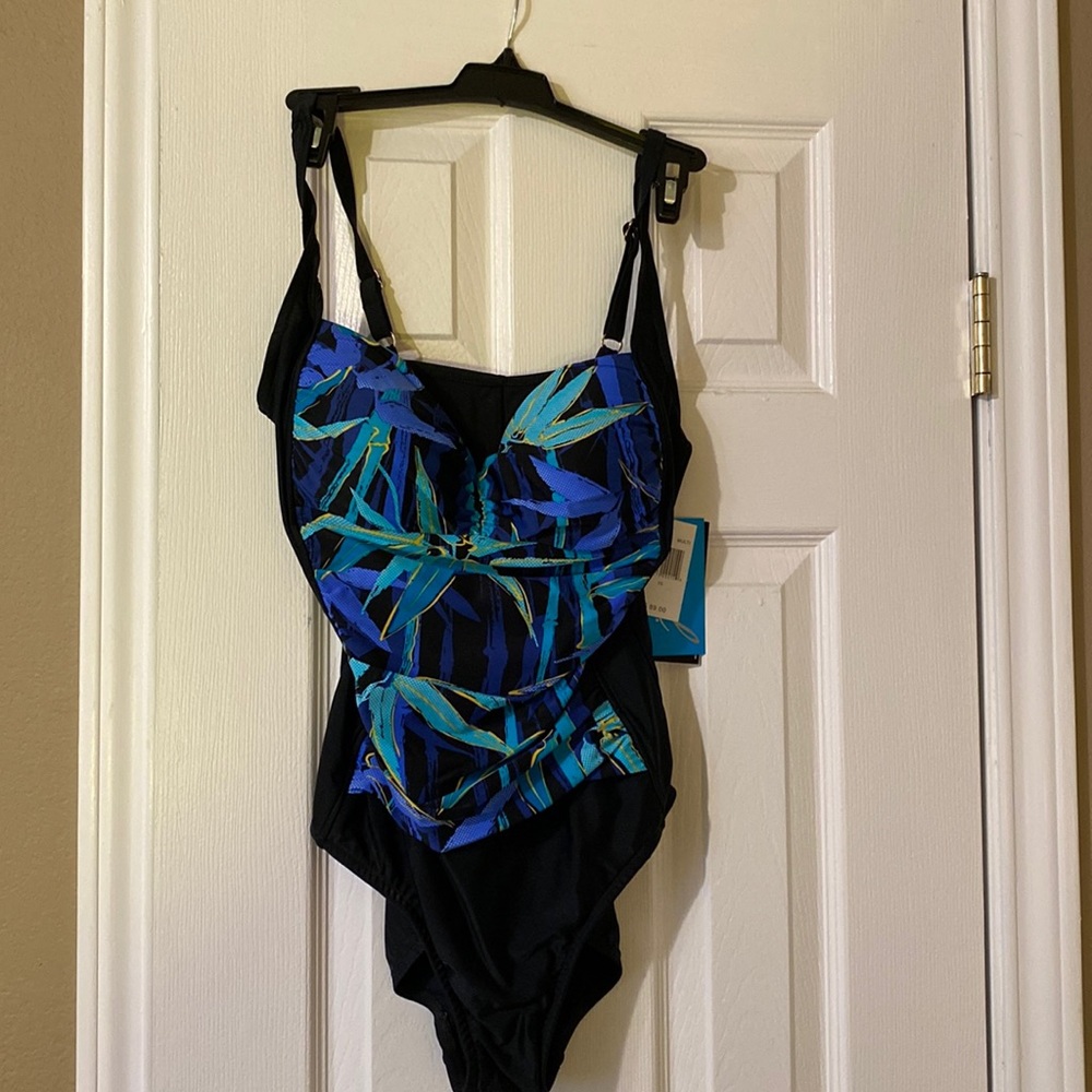 Swimsuit is Azul, size 10,mult-color on front and black back.